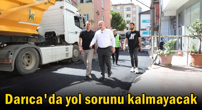 Bıyık, asfalt makinesiyle yolları asfaltladı