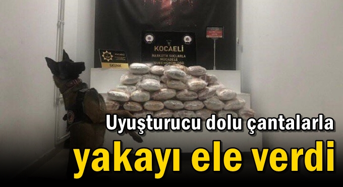 Uyuşturucu dolu çantalarla yakayı ele verdi