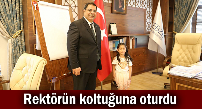 Rektörün koltuğuna oturdu