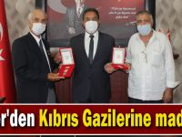 Güler'den Kıbrıs Gazilerine madalya