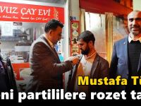 Türel yeni partililere rozet taktı