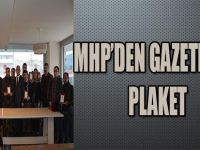 MHP'DEN GAZETECİLERE PLAKET