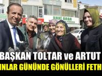Başkan Toltar ve Artut, bayanlara çiçek dağıttı