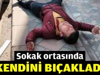 Sokak ortasında kendini bıçakladı