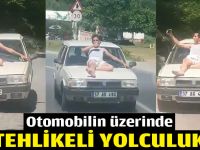 Otomobilin üzerinde tehlikeli yolculuk