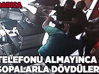 Telefonu almayınca sopalarla dövdüler